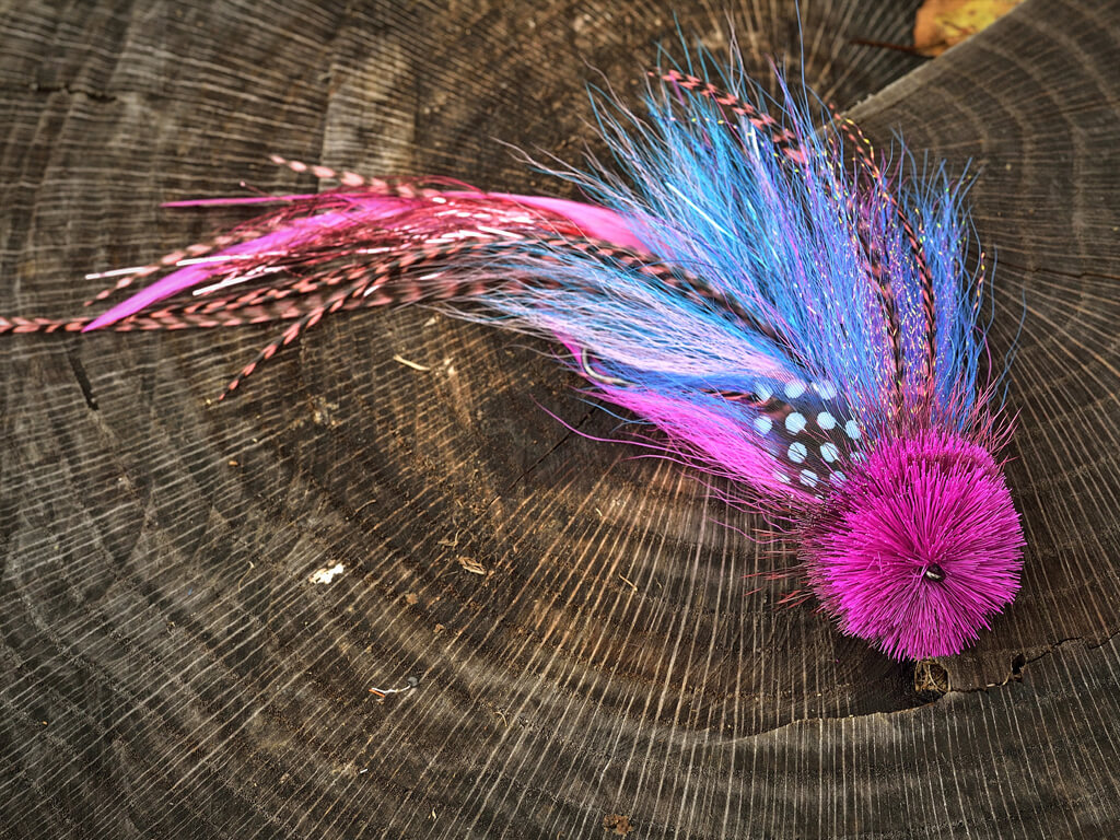 double buford muskie fly shown on wood