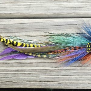 Close-up of a Bluegill fly fishing lure from Urban Fly Co., featuring vibrant colors resembling a bluegill fish, with detailed materials and craftsmanship on display.