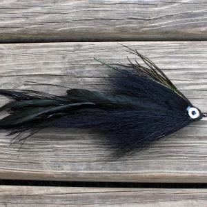 Urban Fly Co. Single Black Minnow fishing lure with a detailed eye, displayed on a wooden deck.